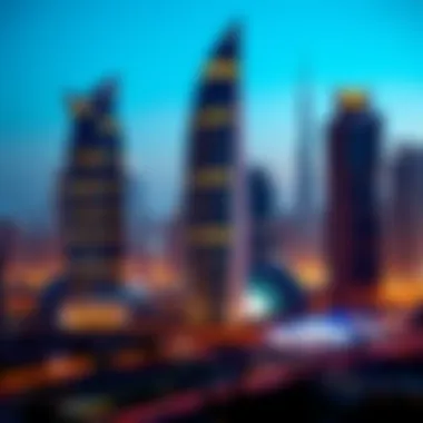 Nighttime illumination of Emirates Towers against the Dubai skyline