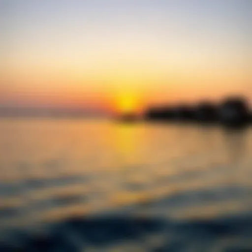 A panoramic view of Umm Al Quwain's coastline at sunset, showcasing the vibrant colors reflecting on the water.